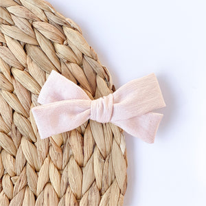 happier pale pink bow